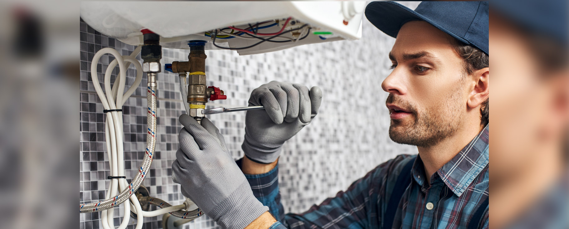 a plumber working on pipes
