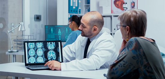 Doctor showing MRI information to a patient