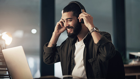 Students in a music studio working with a production console