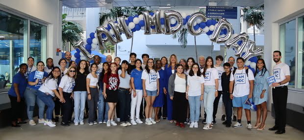 Large group of students pose at Padron Campus